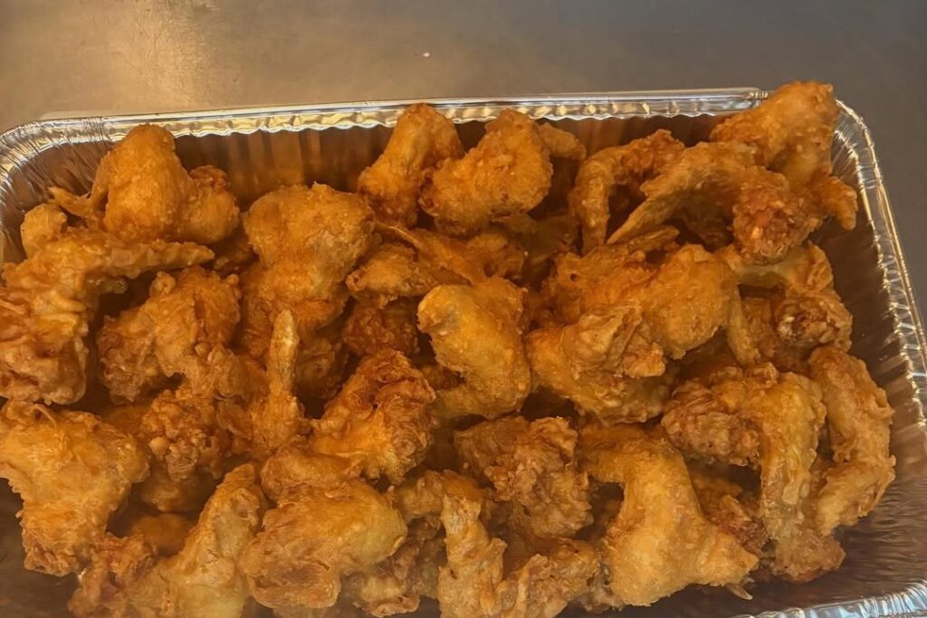 A full tray of golden fried Kim's Wings